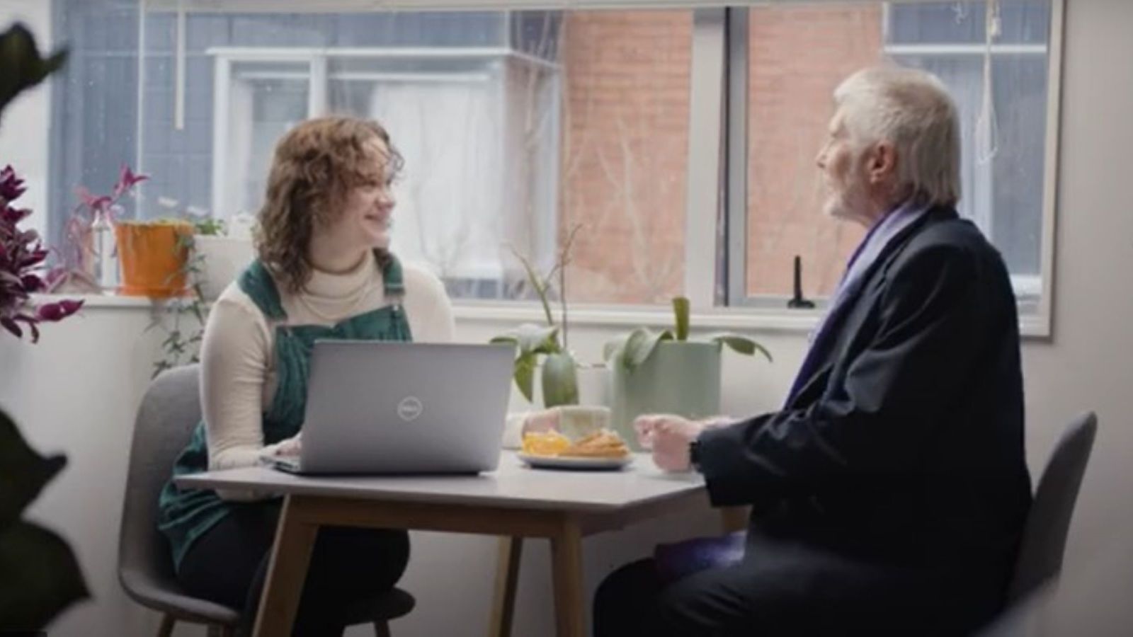 A video still showing a student planning their schedule with an advisor