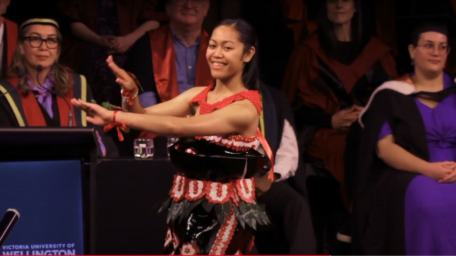 A women performing a dance on the stage.