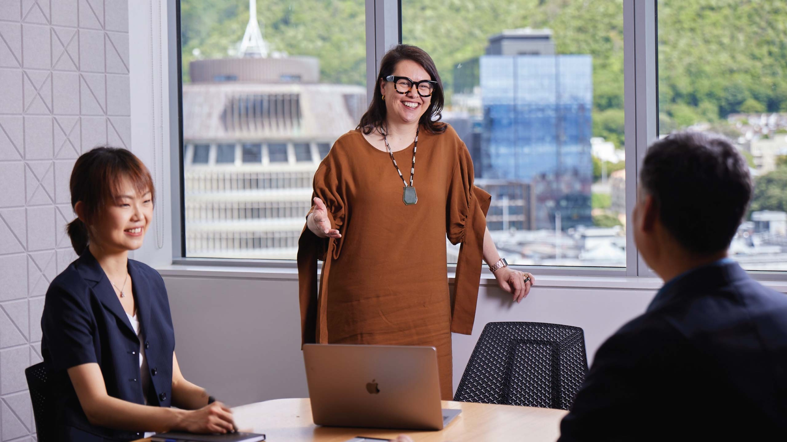 Jennie Smeaton stands in a meeting room.