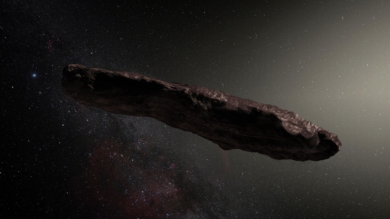 An image of Oumuamua a large asteroid floating in space. 