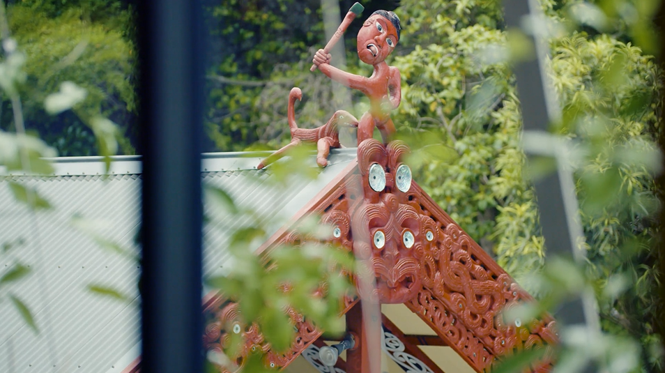 Top section of the carved house showing Maui from a distance