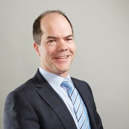 man with pale blue tie