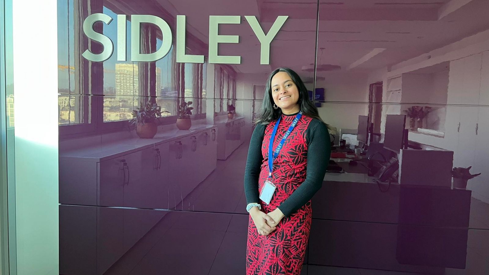 Simran Bechan stands outside Sidley Austin offices in Geneva