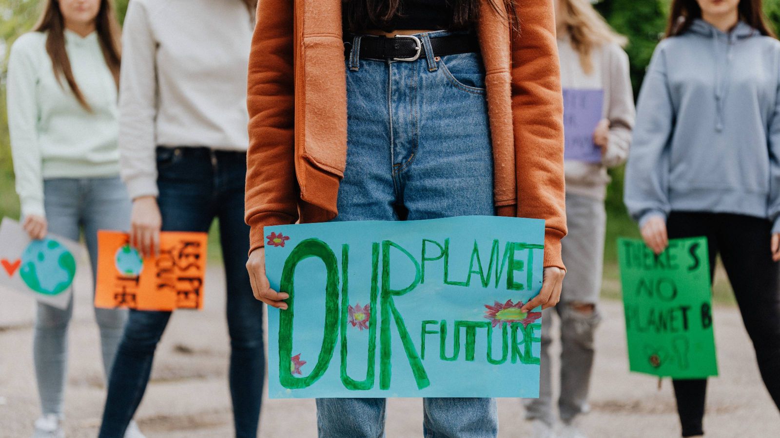 People holding placards at climate change rally