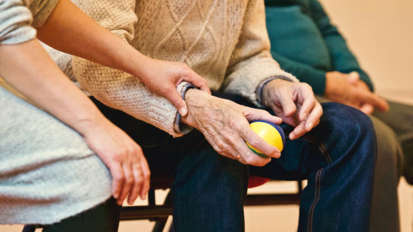 Person holding a stress ball in a waiting room