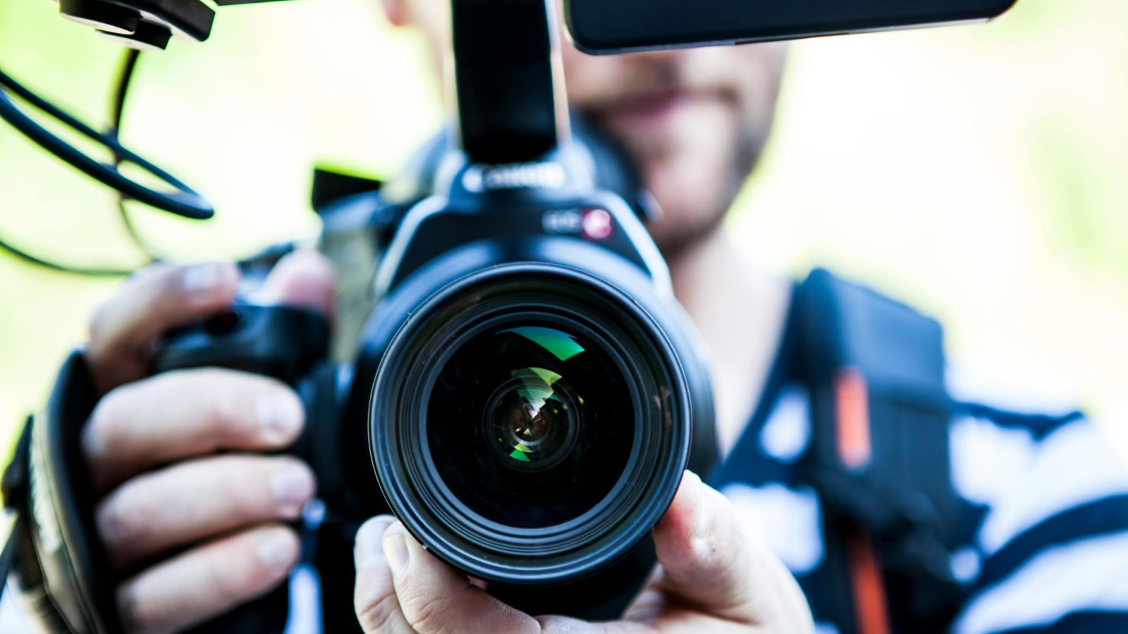 Person holding camera 