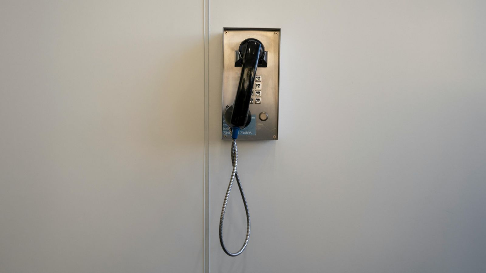 Phone on grey wall 