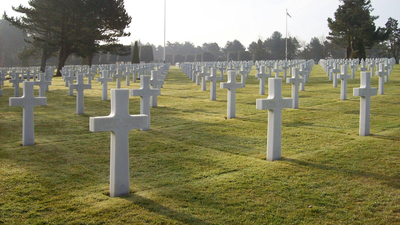 White crosses on a cemetery lawn