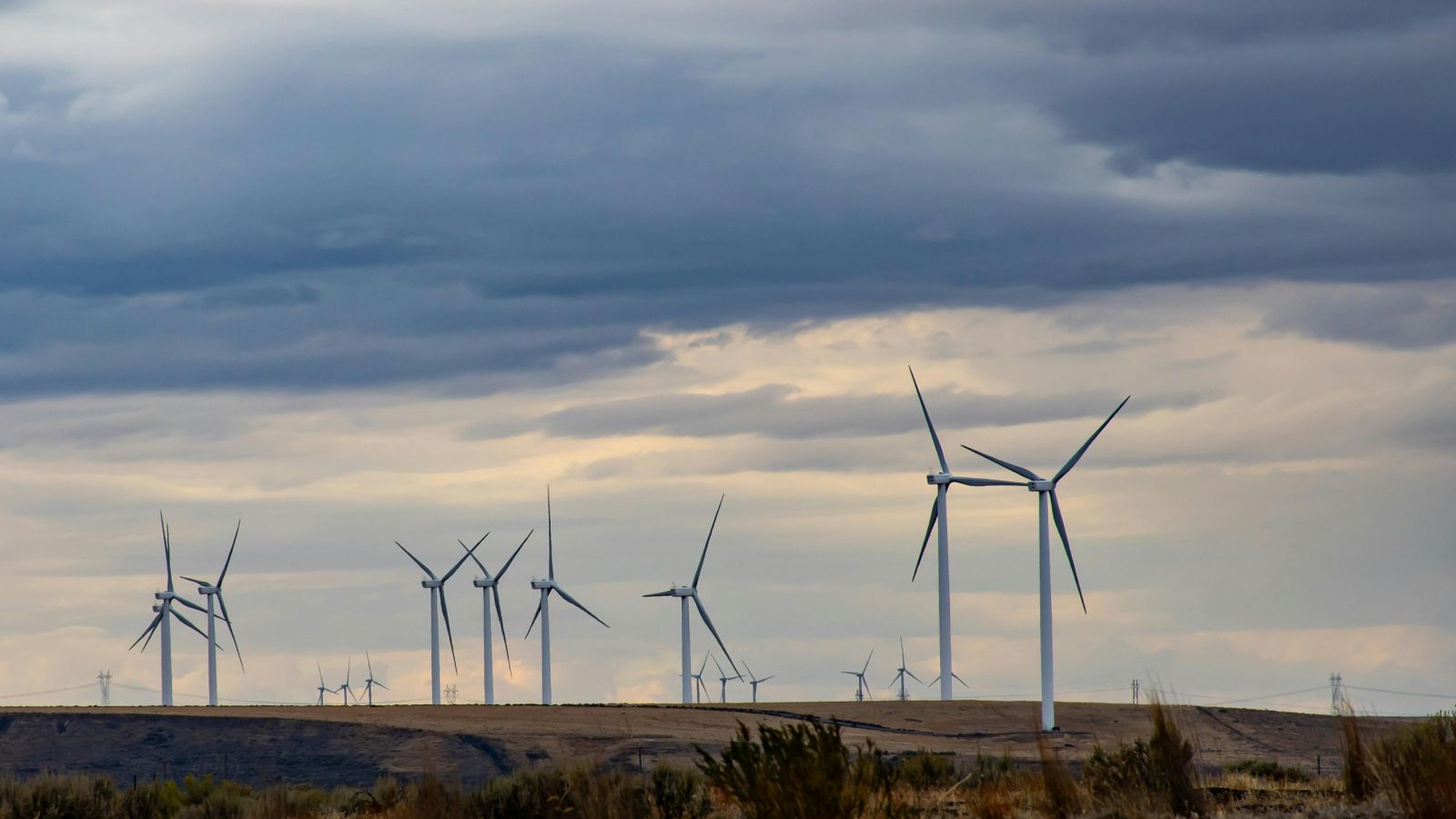 Windmills against a grey sky 