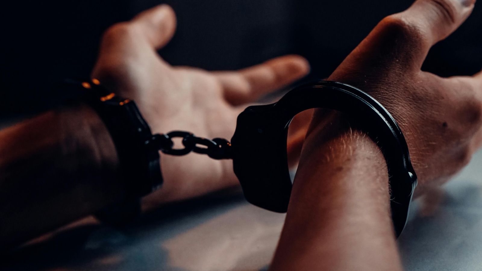 Person with hands in handcuffs 