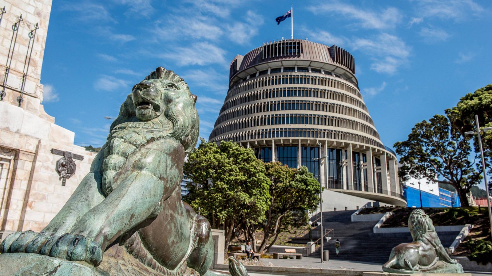 Beehive in Wellington with cenotaph lion in the foreground