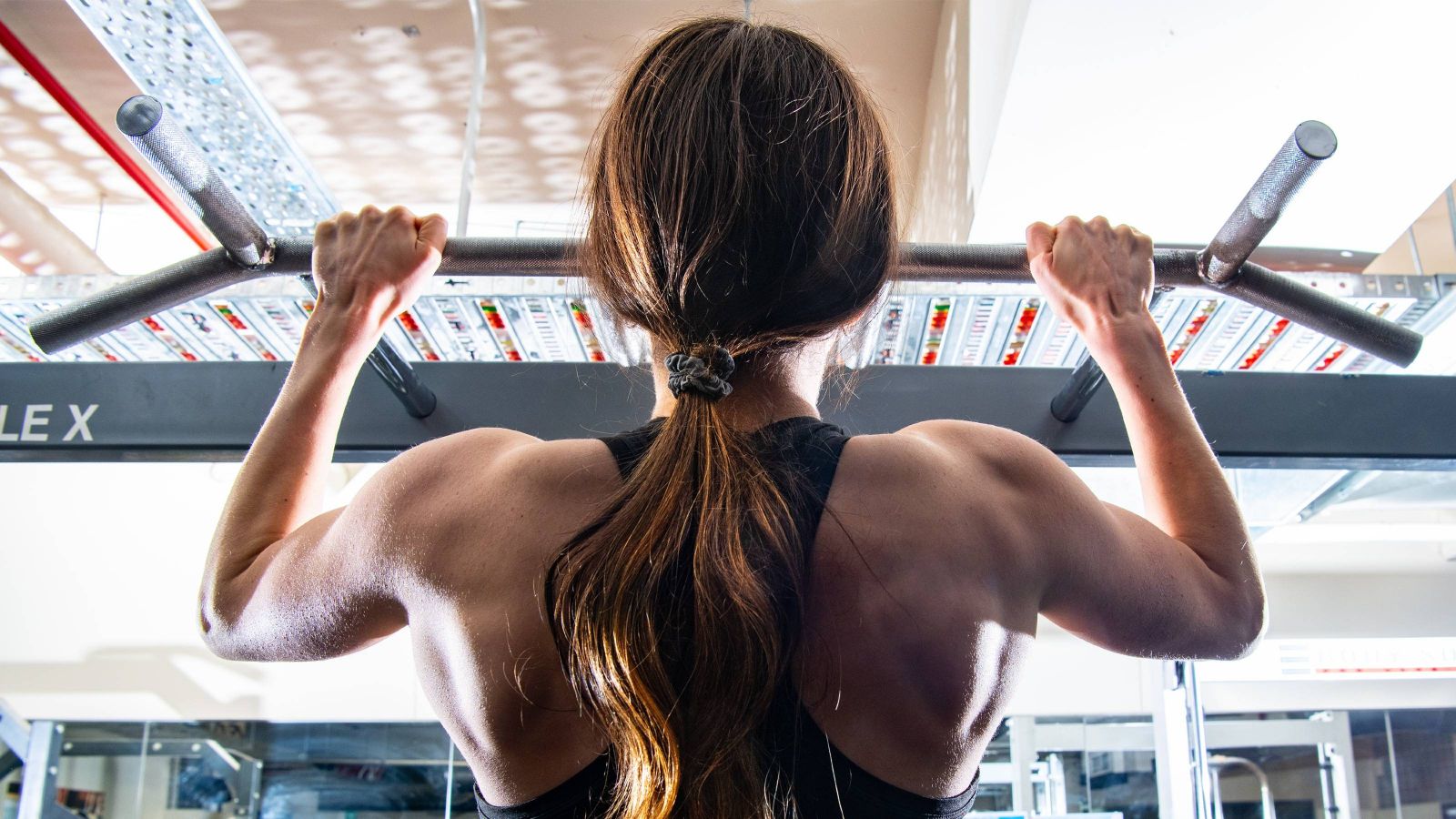 Girl doing a pull up 