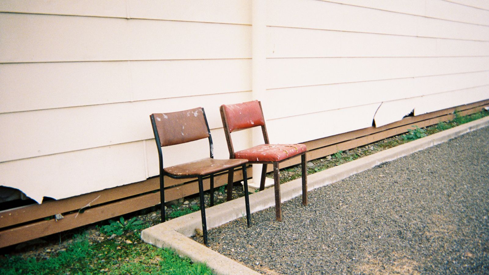 A photo of two chairs placed outside Te Kaha Marae by alumni Ethan Sheaf-Morrison, for his project titled Finding Kuku